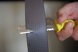 Cutting a seatbelt to rescue with pocket knife