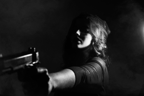 Woman Carrying Gun